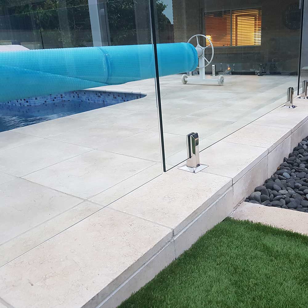 Portland Limestone 400x400x30mm Natural Stone Pavers - Commercial B Grade - Swimming Pool Picture - Available at Simon's Seconds